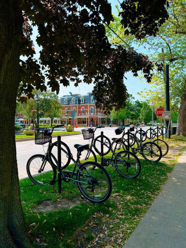 Zoom bikes with Prince of Wales Hotel in background